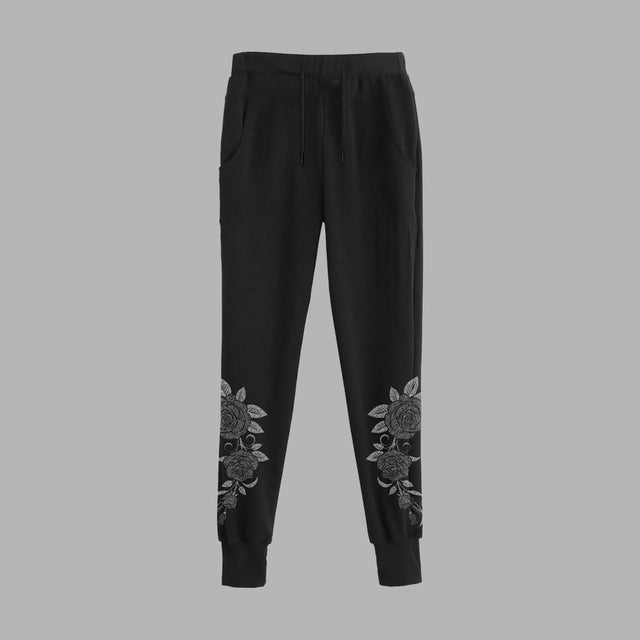Pantalon de survêtement noir avec illustration de roses