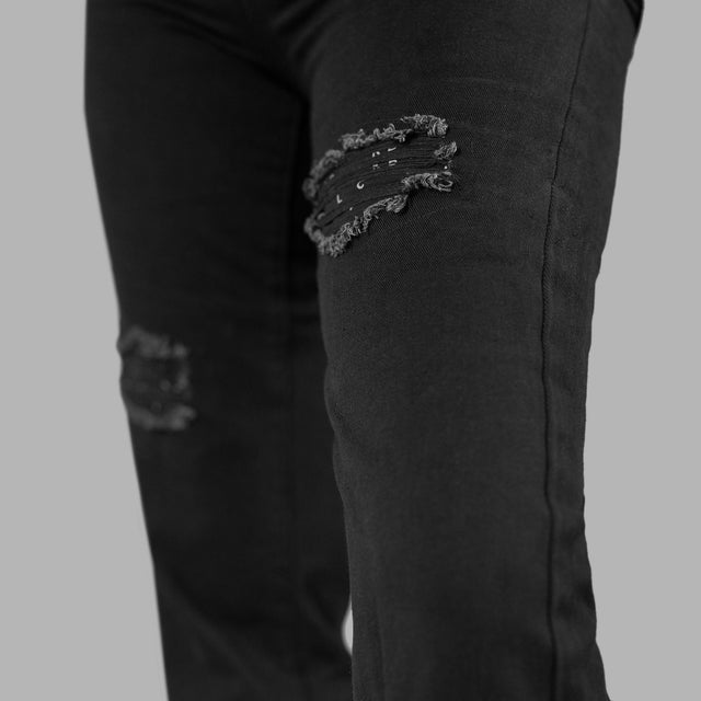 Jean noir déchiré avec monogrammes Blvck